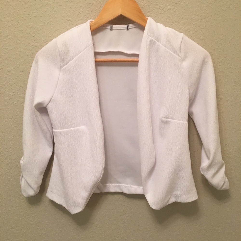 Small white blazer.